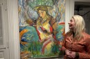 Painter Joanne Landis stands beside her work she says embodies what she's learned from living in Lewisburg. Two of her pieces will be up at The Gallery in Lewisburg until Mar. 15 as part of “Art in Lewisburg: A 50-Year Retrospective."