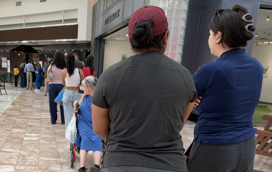 People in El Paso line up at an early voting polling place to cast their ballots in the midterm elections.
