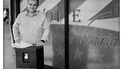 York County voter registrar Walt Latham stands behind the county’s ballot drop box.