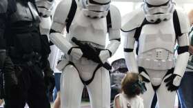Amy Diaz- Members of the 501st Legion interact with children at the Autism Walk and Fun Day at the Orange County Convention Center.