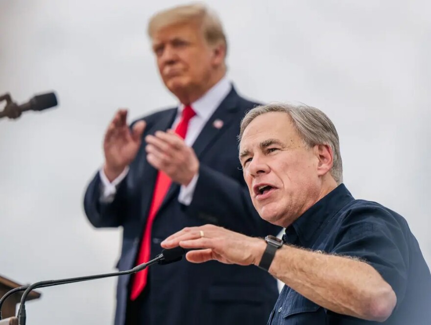 Texas Gov. Greg Abbott speaks alongside then-former President Donald Trump during a tour of an unfinished section of the border wall on June 30, 2021, in Pharr, Texas.