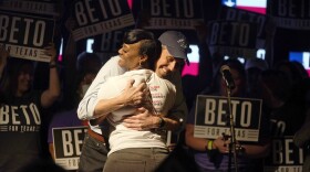 Texas Democratic gubernatorial candidate Beto O'Rourke, right, hugs Crystal Mason after she introduced him to speak during a primary election gathering in Fort Worth, Texas, on March 1.