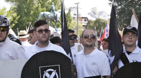 James Alex Fields Jr., second from left, holds a black shield in Charlottesville, Va., where a white supremacist rally took place. Fields, who was the driver in a deadly car attack at the Charlottesville rally, was sentenced to life in prison. (Alan Goffinski/AP)