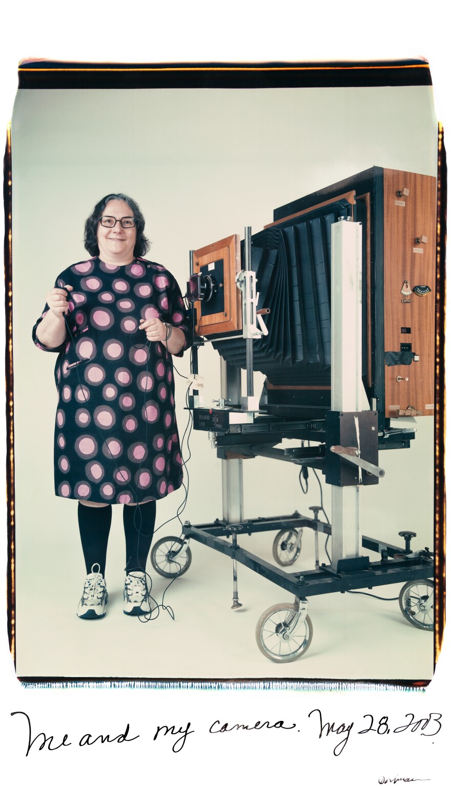 Elsa Dorfman, in self-portrait. The inscription on the bottom of the photo reads, "Me and my camera. May 28, 2003."