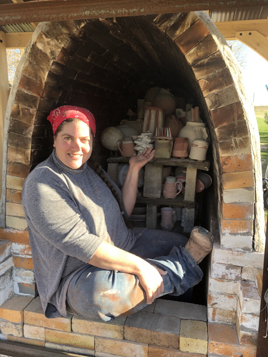Dawn Soltysiak pictured with a wood-fired kiln