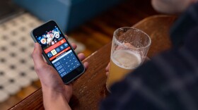 person looking at a sports betting app