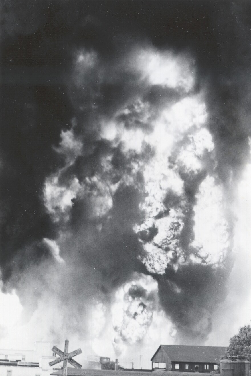 Exploding fuel tanks sent flames towering over Southwest Blvd on the second day of the 1951 Flood
