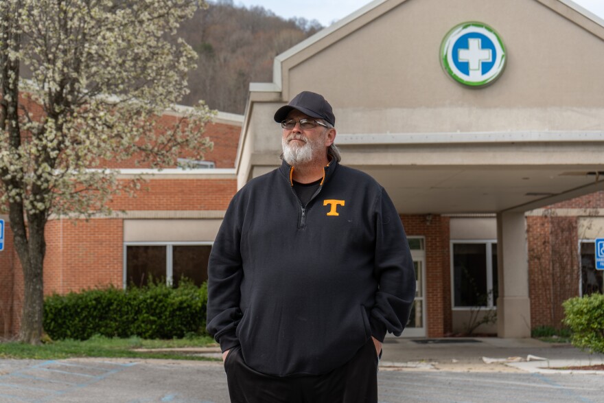 Local minister Benji Johnson stands outside of the shuttered Jellico Regional Hospital on Monday, March 30, 2026.