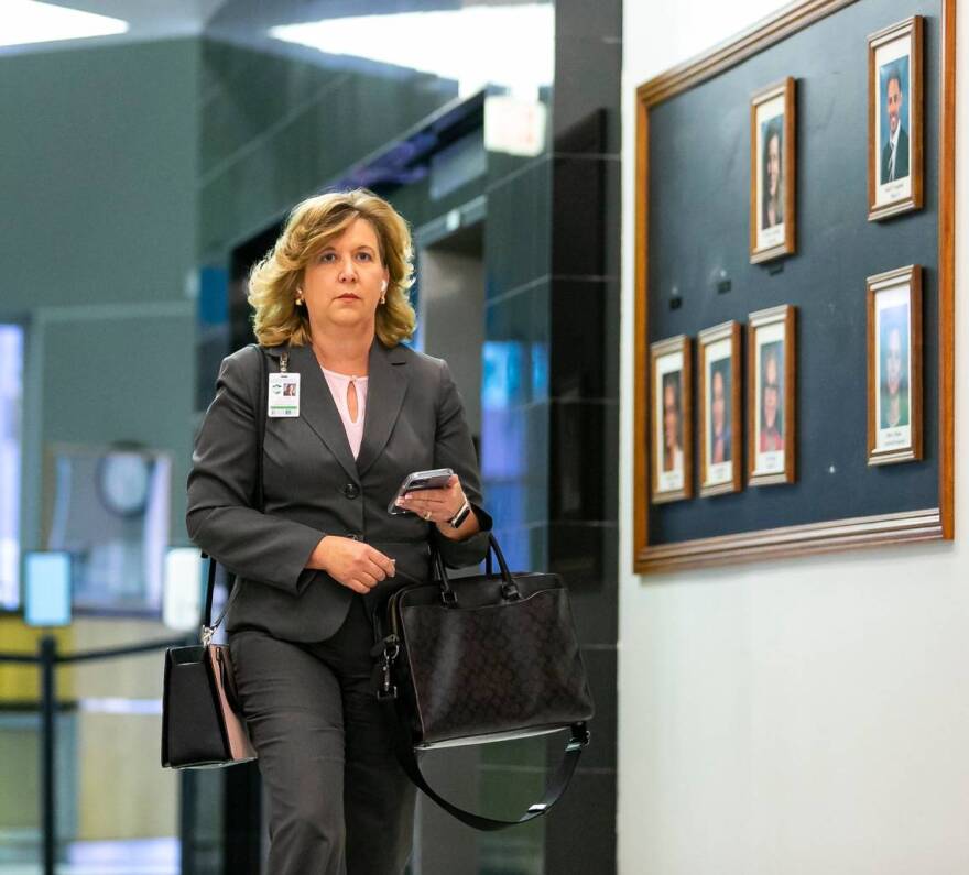 Broward Schools Superintendent Vickie Cartwright exits the Kathleen C. Wright Administration Center on Friday, Aug. 26, 2022 after Florida Gov. Ron DeSantis suspended four Broward County School Board members. As Cartwright left the building, she made her way past a black bulletin board only displaying the five remaining members.