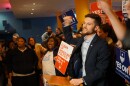 Benjamin Singer, communications director for Clean Missouri, announces victory in the contest to pass Amendment 1 to supporters at Flamingo Bowl in St. Louis.