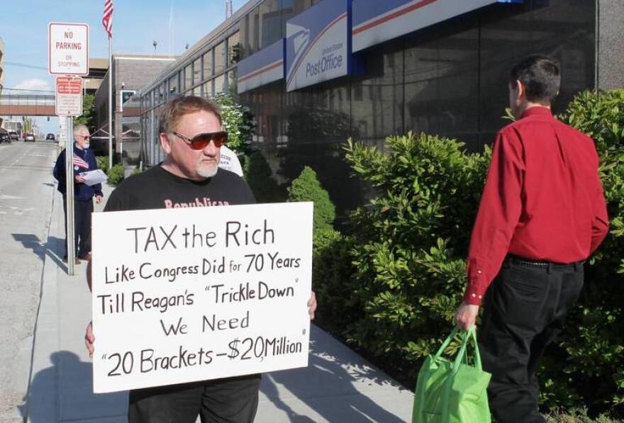 James Hodgkinson of Belleville protests outside of the United States Post Office in downtown Belleville in this file photo from 2012.