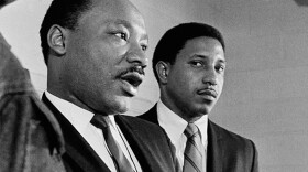 Dr. Martin Luther King Jr. next to a young Bernard LaFayette Jr. in an archival photo