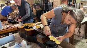 Volunteers working on instruments to send to eastern Ky.