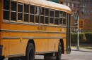 An Akron Public Schools bus drives through Downtown Akron.