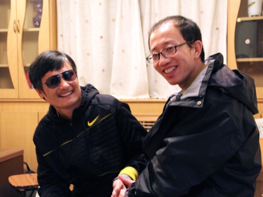 Chen Guangchen, left, meets with fellow activist Hu Jia at an undisclosed location following Chen's escape. "Chen's case has become the epitome of China's human rights situation," Hu says.