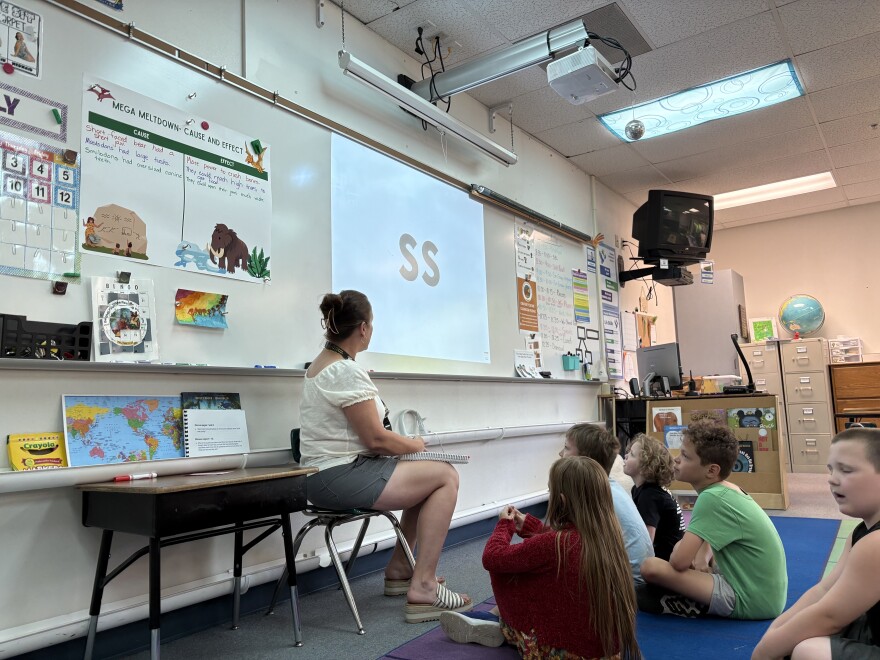In a Prairie Mountain School classroom, first-grade teacher Tami Wold goes through a phonics lesson with her class.