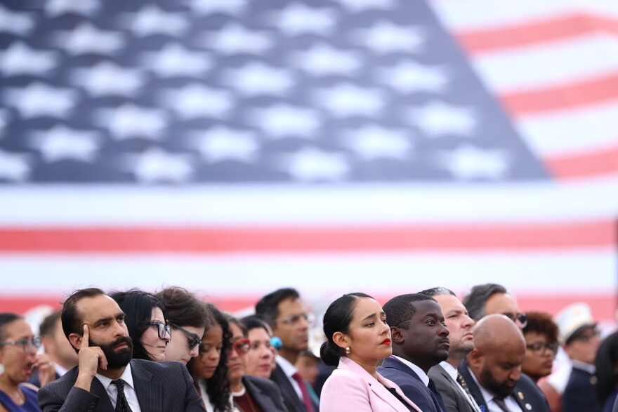Attendees listen to the names of Fire Department of New York, FDNY, members killed during the 9/11 attacks at a memorial to commemorate the 25th anniversary of 9/11, Wednesday, Sept. 9, 2026, in the Staten Island borough of New York. (AP Photo/Pamela Smith)