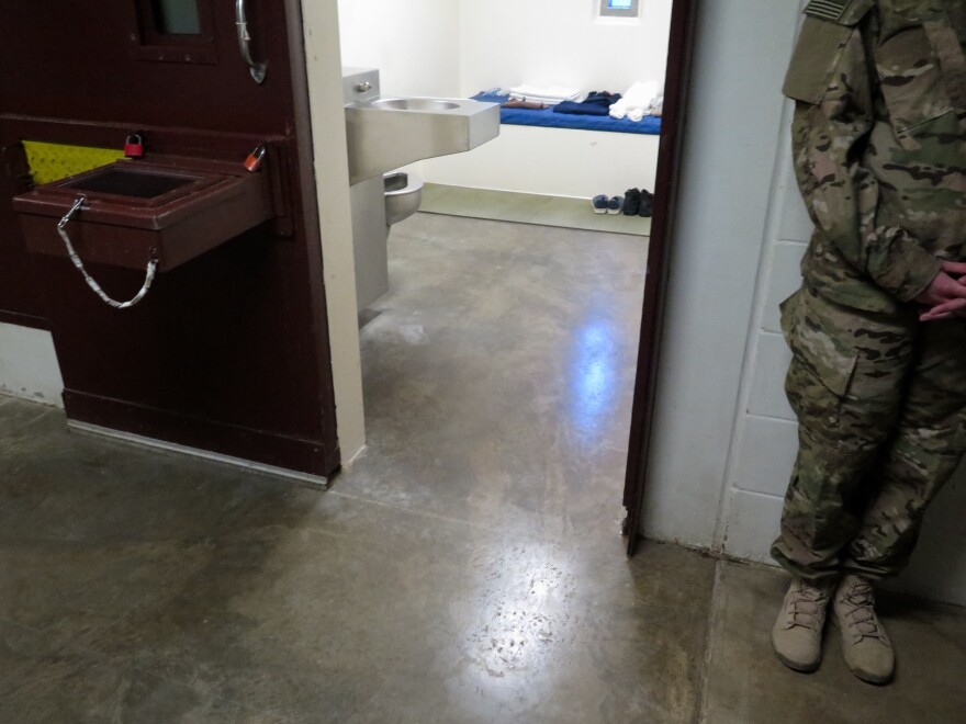 A U.S. military service member stands outside a prison cell at Camp 5. (Photo reviewed and cleared by U.S. military.)