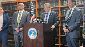 Erie County District Attorney Mike Keane (center, at lectern) announcing a new indictment against Rickey Crouch, who's accused of shooting and killing his ex-girlfriend. Keane also pushed back on talk from some politicians that New York's bail laws played a factor in her death.