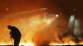 A steelworker works at a steel mill. (China Photos/Getty Images)