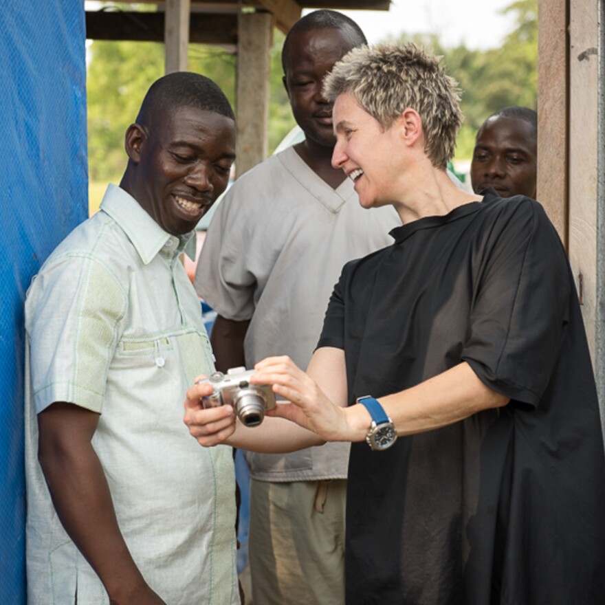 Mary Beth Heffernan shows Dr. Jerry Brown his image on the back of a camera.