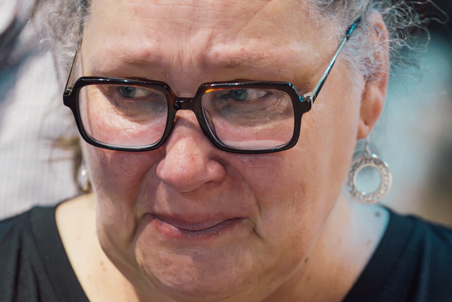 A woman is overcome with emotion during the beatification Mass for the late Archbishop Fulton J. Sheen on Thursday at the Dome.