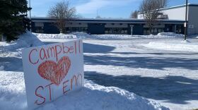 A handmade sign in support of Campbell STEM Elementary School in front of the school's building on March 13, 2026.