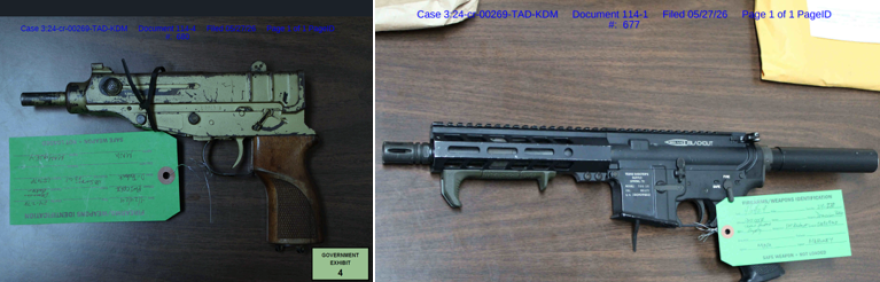 Guns seized as evidence sitting on a table in the Demorion "Duck" Baker case.