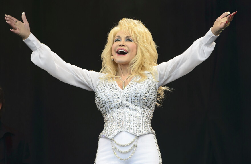 FILE - Dolly Parton performs at Glastonbury music festival, June 29, 2014. (Photo by Jonathan Short/Invision/AP, File)