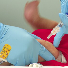 FILE - An infant receives a routine vaccination at First Georgia Physician Group Pediatrics in Fayetteville, Ga., Aug. 17, 2021. About 25 million children worldwide missed out on routine immunizations against diseases like diptheria, largely because the coronavirus pandemic disrupted regular health services or triggered misinformation about vaccines, according to the U.N. In a new report published Friday, July 15, 2022 the World Health Organization and UNICEF said their data show 25 million children last year failed to get vaccinated against diptheria, tetanus and pertussis, a marker for childhood immunization coverage. (AP Photo/Angie Wang, file)
