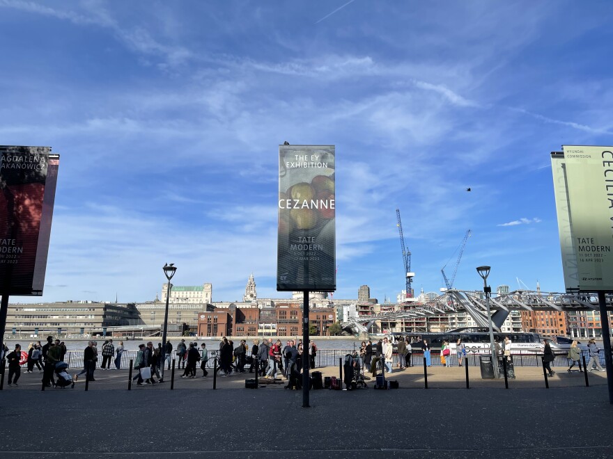 Looking out from The Tate Modern across the Thames River to The Big Smoke, as London used to be called before they cleaned up their air quality act. Huge banners announce the current exhibitions.