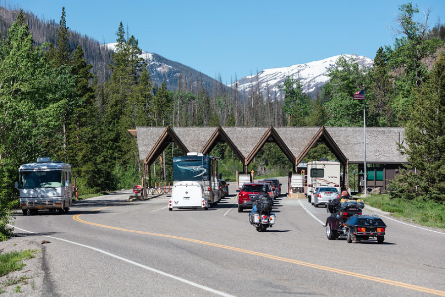 cars waiting at Yellowstone National Park gates 