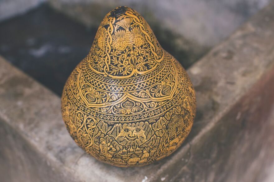 The sisters use carving tools to create the images and a heated stick to burn in colors.