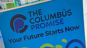 A sign reads "The Columbus Promise. Your Future Starts Now." 