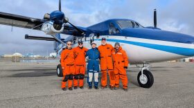 Members of the Arctic AIR team pose for a photo in front of NOAA's Twin Otter aircraft on the tarmac of Deadhorse Airport. (Photo courtesy of Arctic AIR)