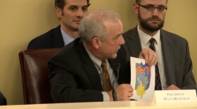 Senate President Matt Huffman (R-Lima) holds up his proposal for a new Congressional district map at a meeting on March 1, 2022 at the Ohio Statehouse.