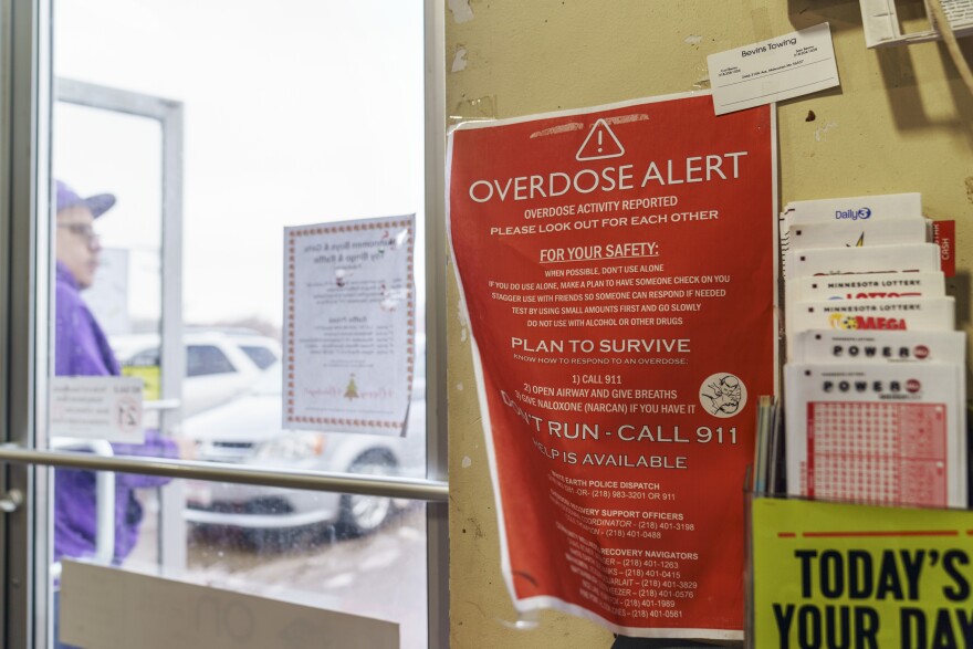 A sign calling attention to drug overdoses is posted to the door of a gas station on the White Earth reservation in Ogema, Minn., Tuesday, Nov. 16, 2021. The drug crisis has diversified; it is no longer an opioid epidemic but one in which people are dying from deadly cocktails of many drugs. Deaths involving methamphetamine have nearly tripled in recent years, with Native Americans now 12 times more likely to die from it.