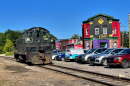 A freight locomotive on the Luzerne County-owned rail line passes South Wilkes-Barre businesses along Horton Street in 2024.