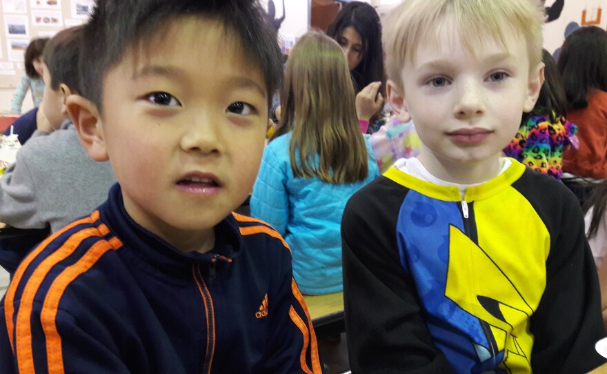 Grant Choi, left and his friend Jack Scholl eat lunch at Puesta del Sol Elementary School in Bellevue.