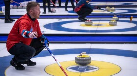 Andreas Hårstad, skip of the Norwegian team, gestures to his teammates at the World Curling Championships in Ogden, March 27, 2026