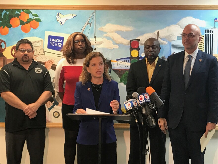 U.S. Reps. Debbie Wasserman Schultz and Ted Deutch addressed the government shutdown on Tuesday alongside unpaid federal workers. 