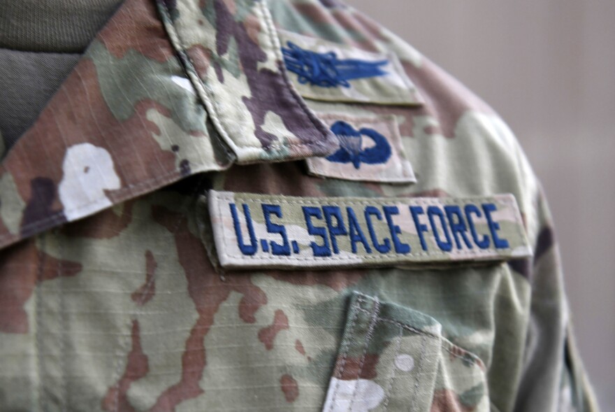 An image of a torso of someone wearing a military uniform that has a patch that says "U.S. Space Force"