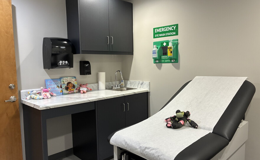 Exam room with stuffed animals and children's books
