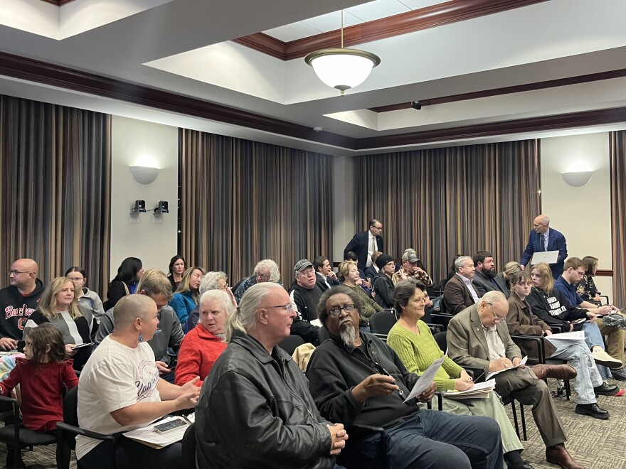 People sit in nearly every chair in Hamilton's City Council Chambers.