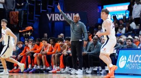 Head Coach Adrian Autry (Pointing) giving directions against Virginia on Saturday.
