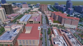 an above view of the proposed developments to the plaza showing the height difference of the old and new buildings, wider streets, and angled parking