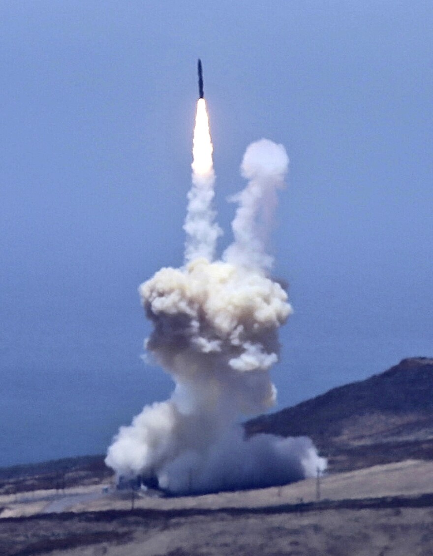 A rocket designed to intercept an intercontinental ballistic missile is launched from Vandenberg Air Force Base in California on Tuesday. The Pentagon says it shot down a mock warhead over the Pacific in a success for the U.S. missile defense program.