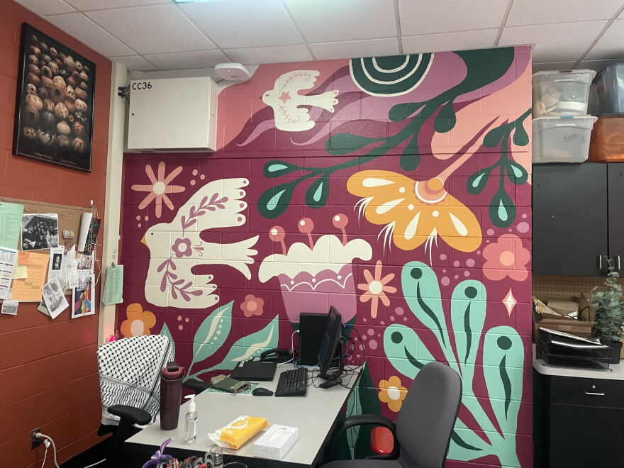 After their art classroom flooded, Riverside University High School art teacher Paige Bauske and her students painted this mural to bring color and new life back into the space. Many of the art materials were lost in the August 2025 floods.