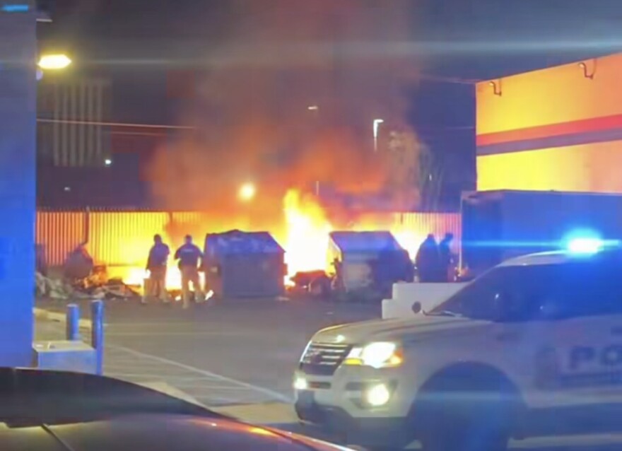 A fire at the homeless encampment at quirky Used Books this morning did not leave anyone with injuries, but did destroy several tents and personal belongings. (Screenshot from video posted by KOB News)