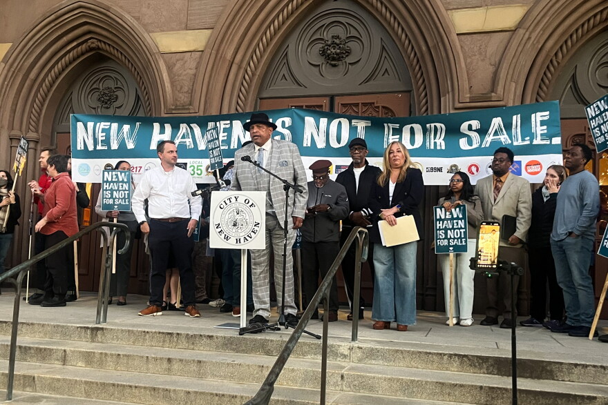 Pastor Scott Marks, Director of New Haven Rising at the microphone as he joined with local organizers and tenants during a press conference October 20, 2026 outside the New Haven City Hall to ban short-term rentals in an effort to protect New Haven's housing market.
